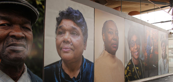 Portreadau o bobl o’r arddangosfa Windrush yn y Senedd